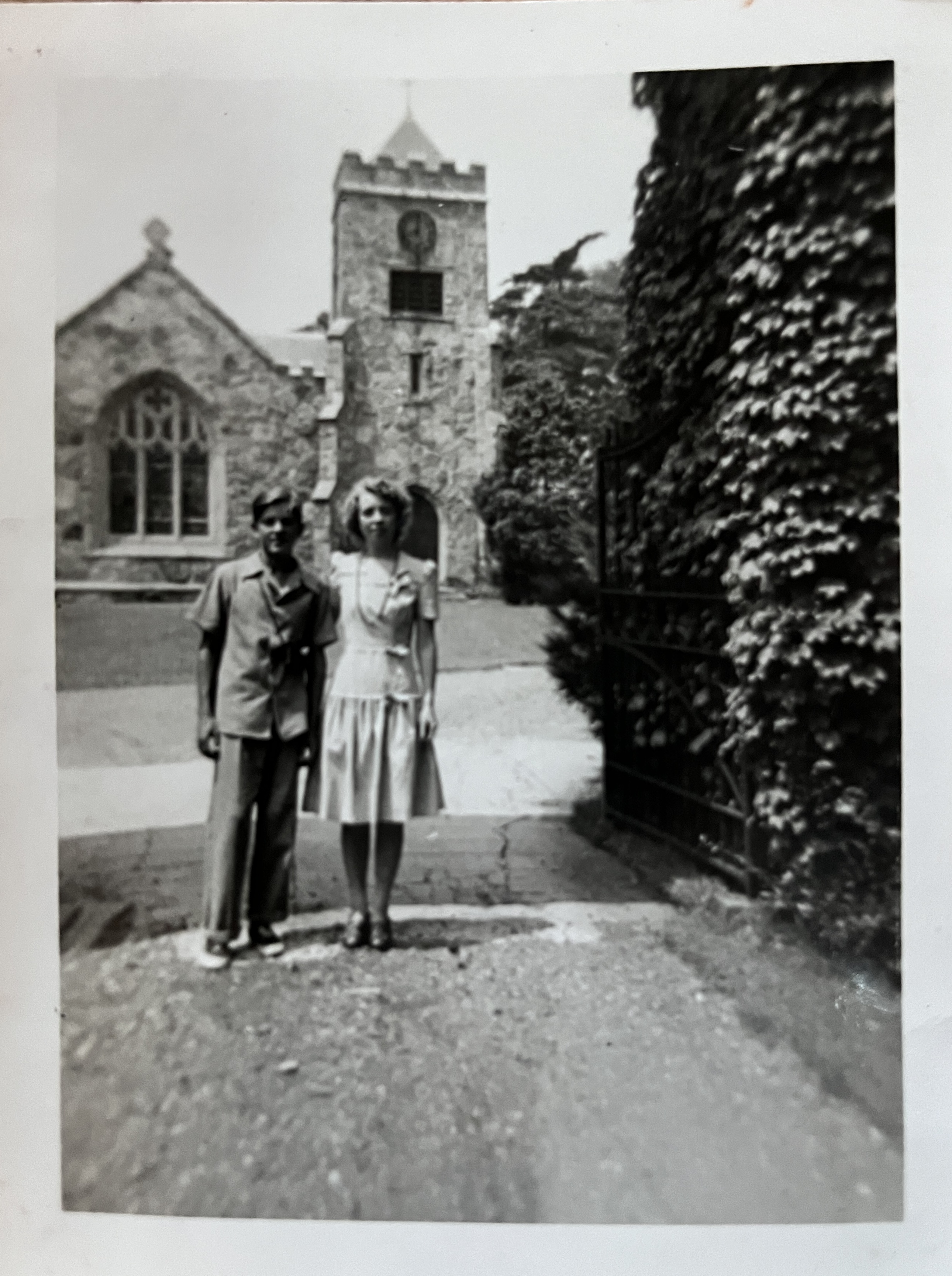My grandmother and her brother posing at the entrance arch of Harmony Grove Cemetery in Salem, MA